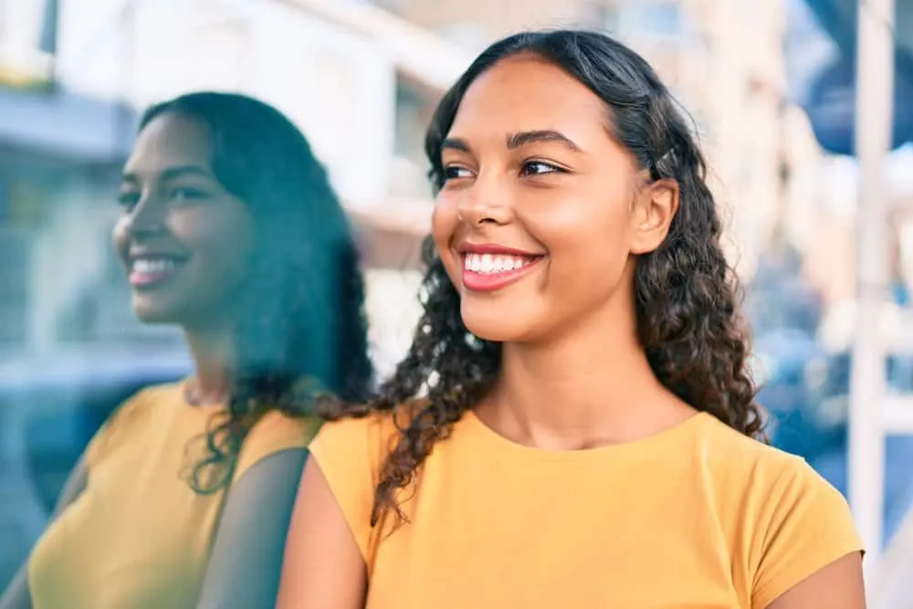 How Long Does It Take for Edges to Grow Back? Bald Edges? 3 A light-skinned mixed-race female with healthy edges styled olive oil and natural oils.