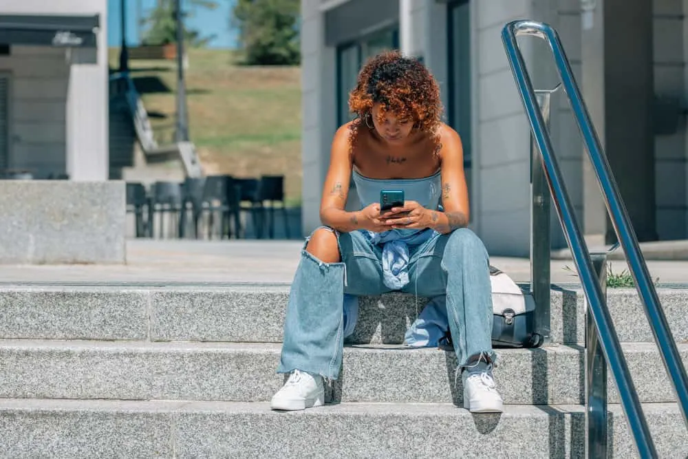Can You Dye Your Hair Right After Bleaching It? What Happens? 6 A Latin African American woman with curly hair cuticles has healthy hair following multiple hair bleaching treatments.
