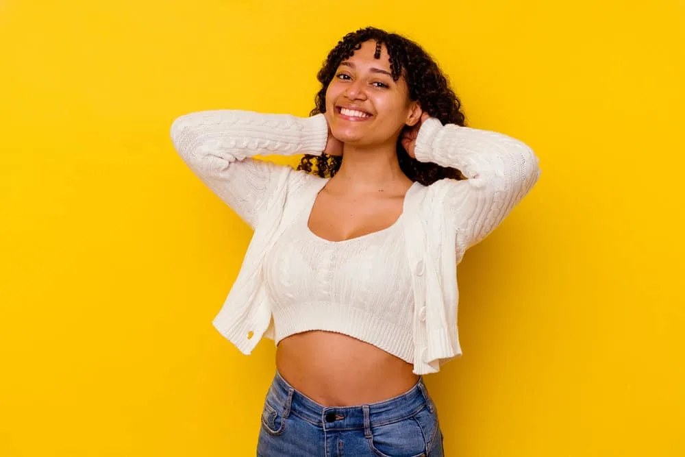 How Long Should I Wait Before Texturizing My Hair Again? 2 A cute black girl with 3B natural curls wearing a wash-n-go hairstyle that shows off her natural curl pattern.