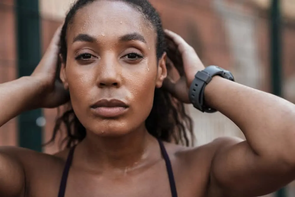 Why Does My Hair Itch When I Sweat, Get Hot, or Workout? 1 A young fit female that has an itching scalp aka atopic dermatitis due to a fungal infection and can't stop scratching.