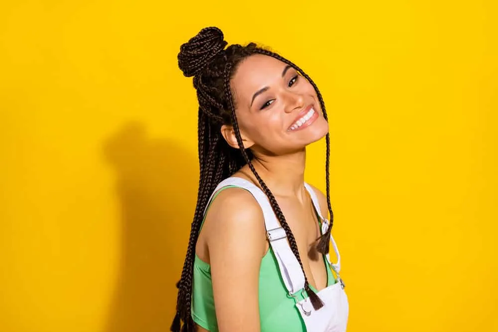 How Long Can You Keep Braids in Your Hair Without Issues? 2 An adorable African American female with braided hair in long box braids made popular by a celebrity stylist.
