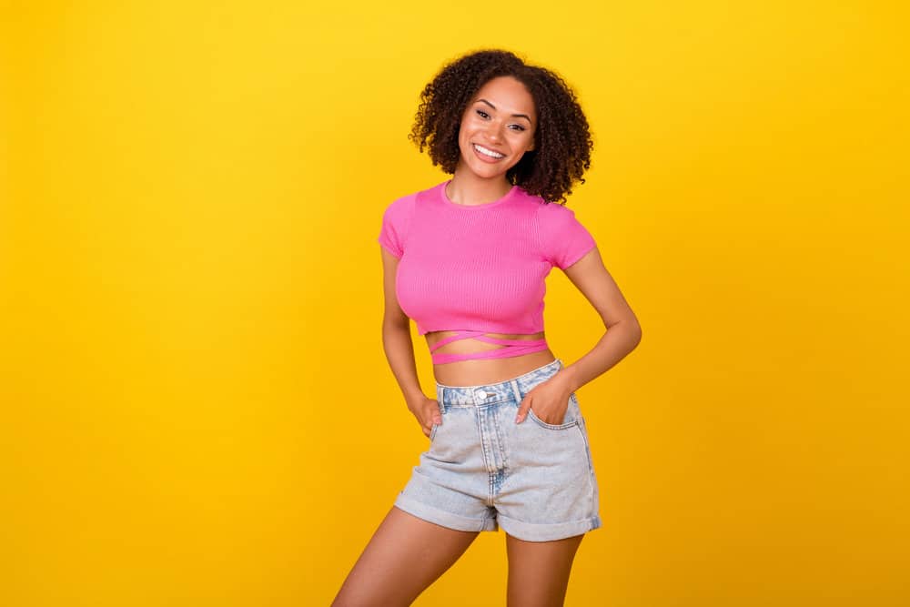 A brunette with brittle hair that has been treated with mineral oil to add moisture to the hair shaft and reduce dryness.