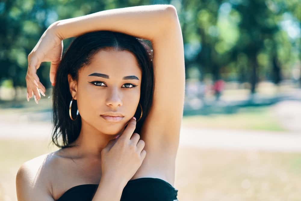 A light-skinned black girl experienced hair shaft damage after using hair dryers daily on her own hair.