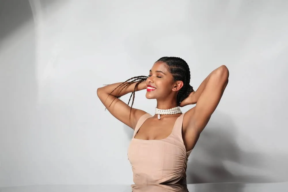 Box Braids vs. Cornrows: Which Is Better? What’s the Difference? 4 A black female wearing one of our favorite combo braid styles with human extension hair to make the hairdo longer.