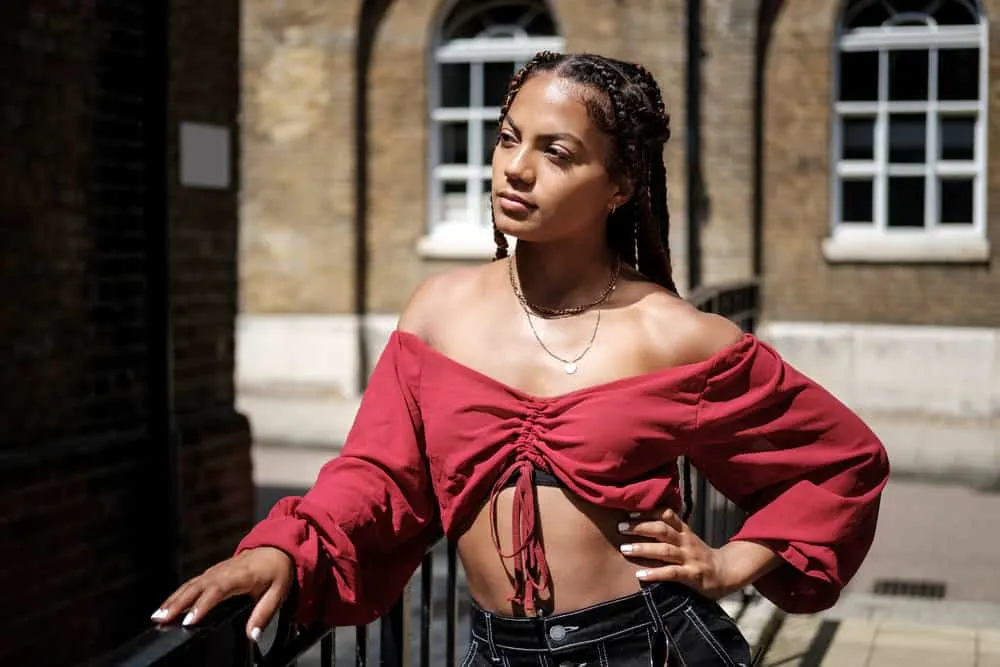 Can I Dye My Hair After Taking Out Braids? Right After? 3 A female with type 3 natural hair styled in a braided hairdo with natural oils and a medium-brown new color.