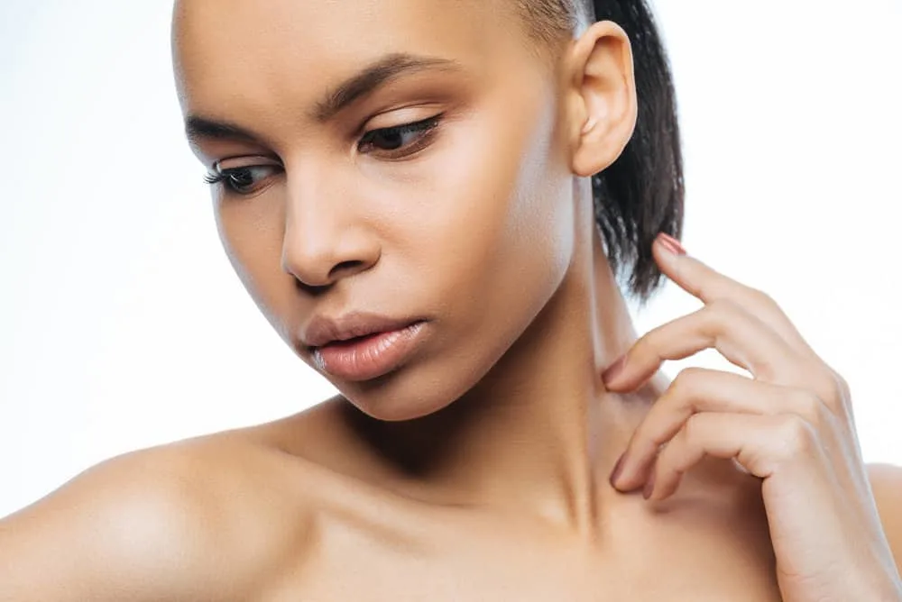 How to Grow a Mullet Out Faster From Thick or Thin Hair 3 A graceful black girl with a wavy mullet hair cut on straight hair with just the right amount of party in the back.