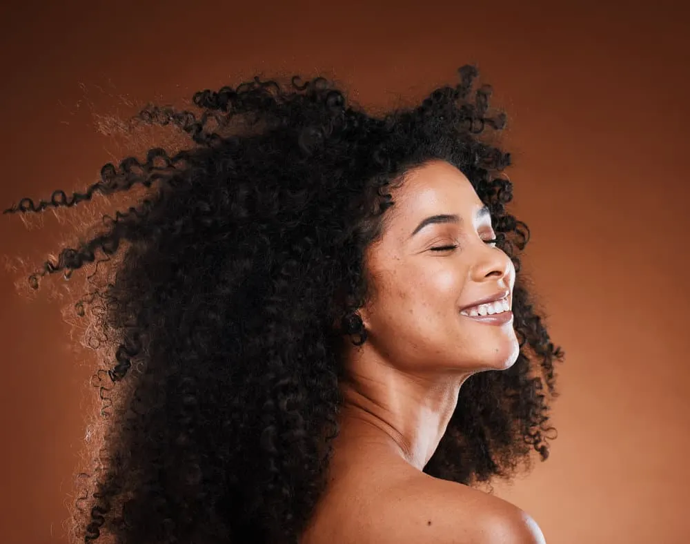 What Is Conditioner Used For? Is It Needed? What Does It Do? 3 A cute African American female that keeps her hair soft by using deep conditioners once every two weeks.