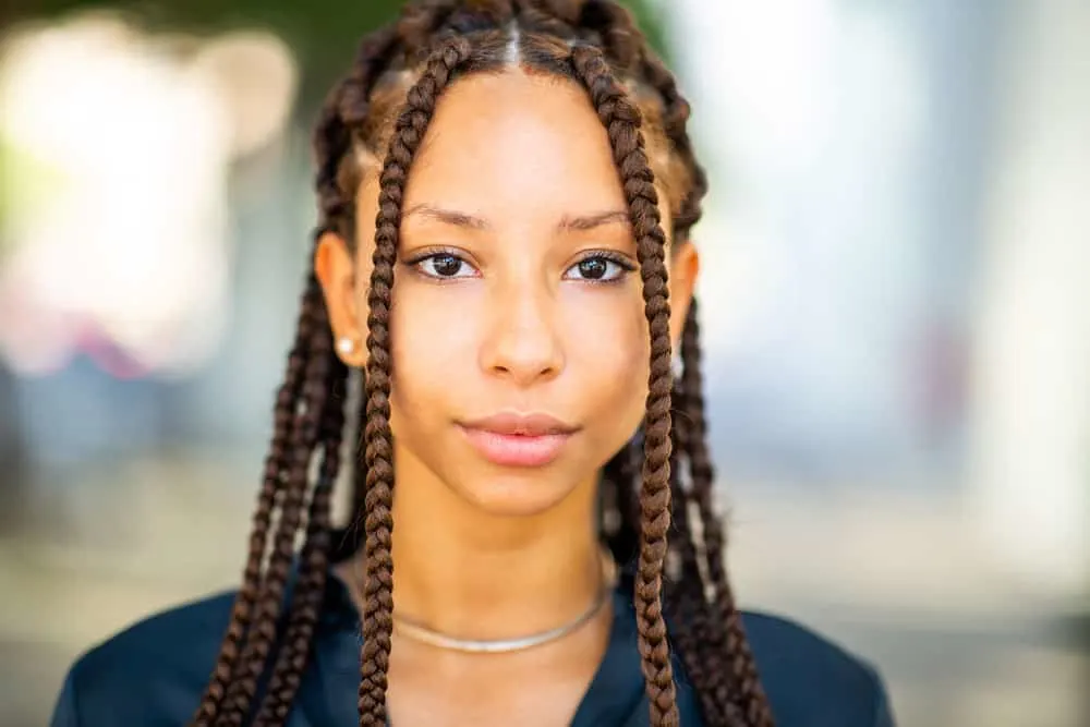 The 10 Best Summer Protective Hairstyles for Natural Hair 1 A cute black female is wearing Fulani brands on her 4A natural hair type, which is a great protective style for summer.