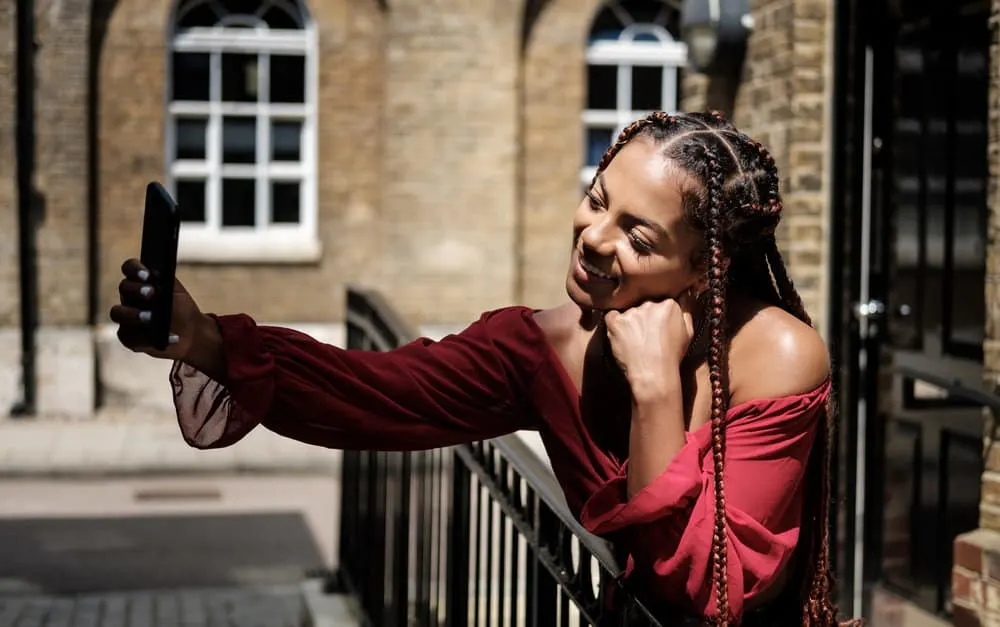 Can I Dye My Hair After Taking Out Braids? Right After? 7 A black girl takes a selfie after deciding to dye hair with Manic Panic Dye Hard hair care products.