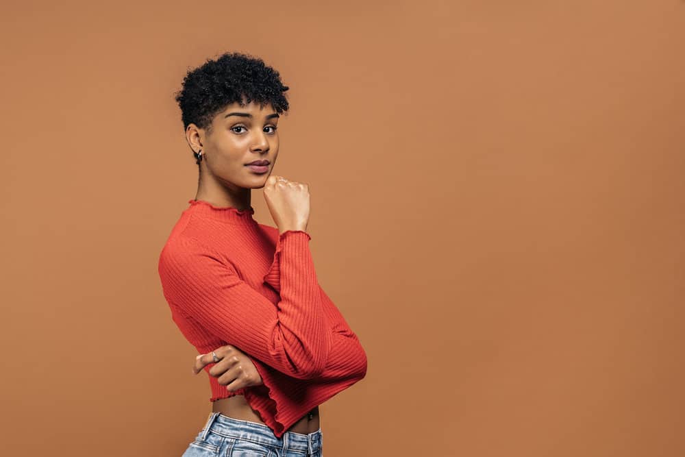 A beautiful black woman that has been using t gel shampoos to prevent scalp itching due to excessive sweating.