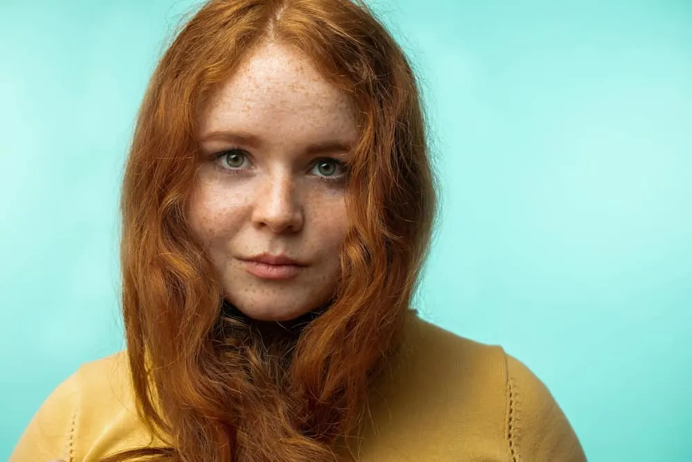 How To Repair Damaged Hair Follicles Fast & Naturally at Home 9 A beautiful girl with gorgeous curly hair is starting a healthy hair growth journey based on her type 2 hair texture.