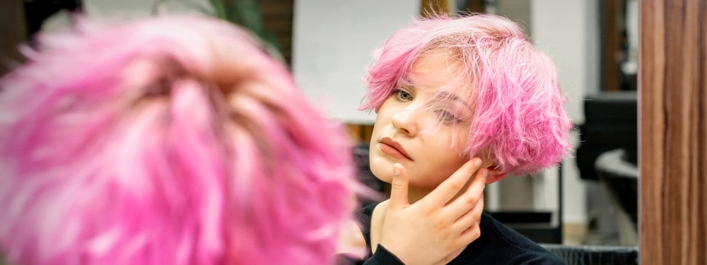 A beautiful young Caucasian female dyed her hair in the bathroom sink leading to tough stains from the hair dyes.