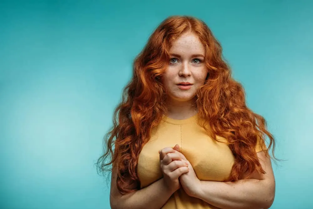 How To Repair Damaged Hair Follicles Fast & Naturally at Home 11 A cute young white girl with dyed hair has heat damage and breakage caused by wearing excessively tight hairstyles.