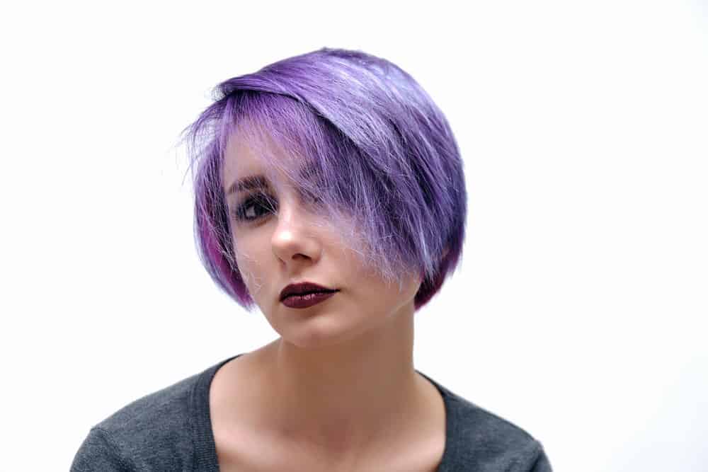 A bi-girl wearing a style that's popular among queer women and others in the LGBTQ community with longer hair.