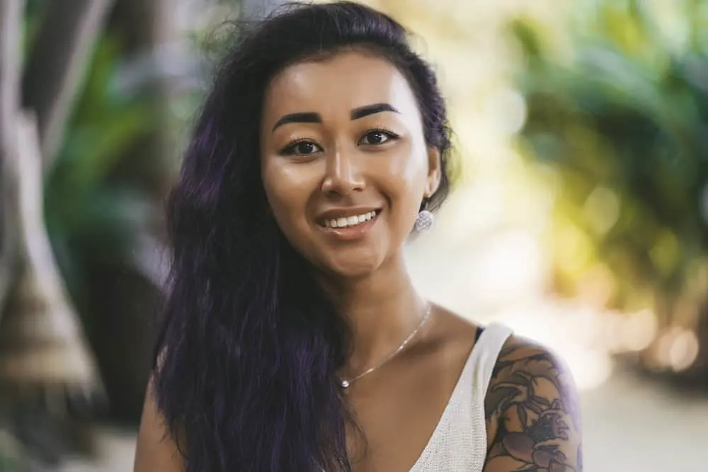 Is Redken a Good Brand for Your Hair or Is It Bad for Curls? 1 A beautiful woman with a fine hair type washed with Redken shampoo and styled with a soft conditioner.
