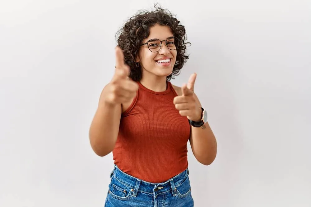 Do Mexicans Have Curly Hair? Is Curly Hair Common in Mexico? 5 A beautiful Hispanic woman with brown skin that looks like it comes from African ancestry (e.g., sub-Saharan Africa).