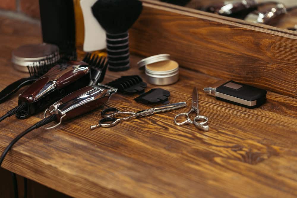 African American barber installed replacement blades with two screws that he purchased from a hardware store.