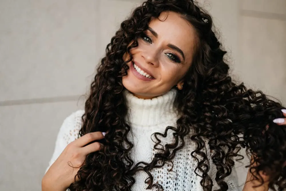 How Much Does a Perm Cost for Girls and Guys at a Salon 2 A cute white woman with a medium hair length and 1B natural hair texture recently got a cold perm solution.