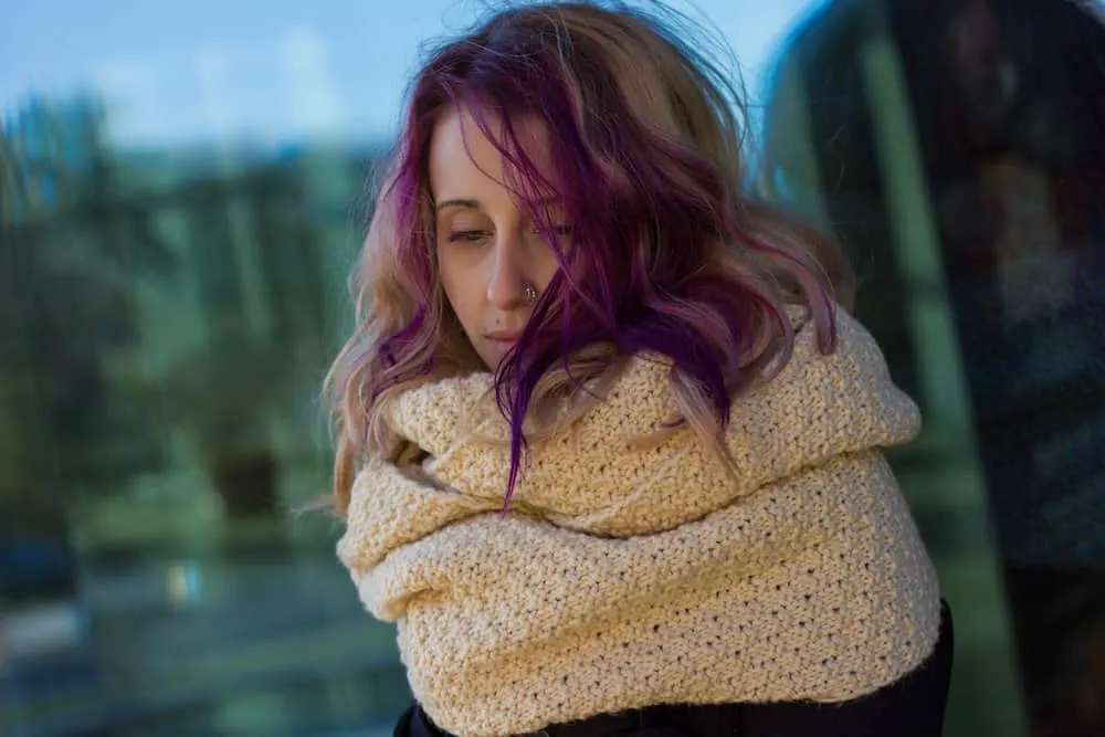 How to Get Hair Dye Off Forehead: DIY Step-by-Step Guide 10 A stylish young white girl with wore gloves to prevent hair dye stains when dyeing her locks purple.