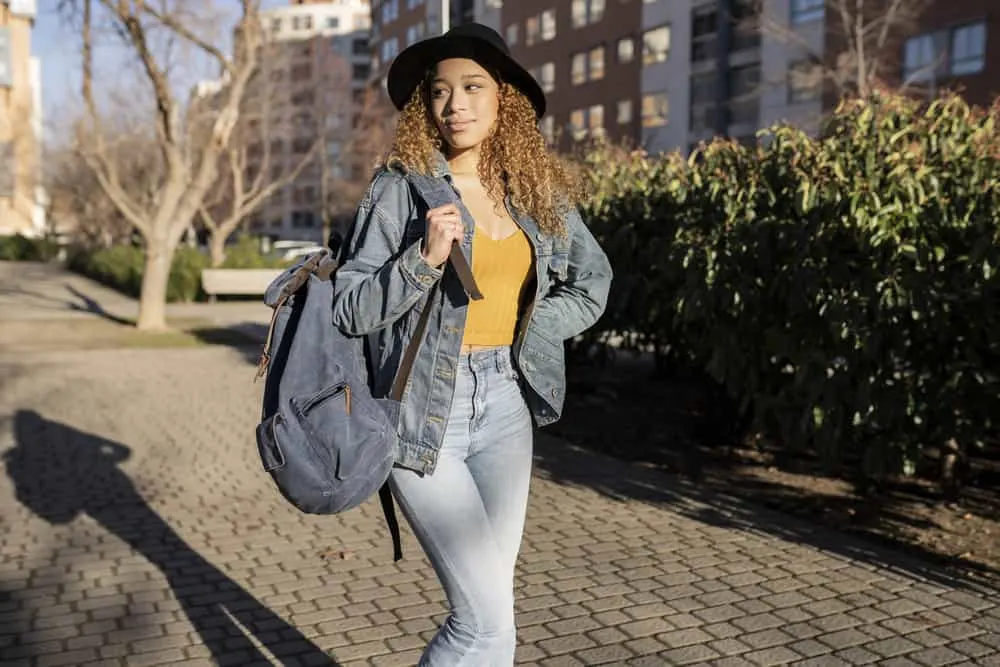 15 Cute Birthday Hairstyles for White and Black Girls 30 A stunning lady with voluminous curls artfully arranged in a beautiful birthday hairstyle on a balayage hairdo.