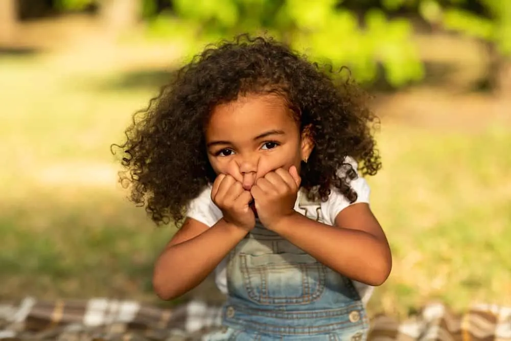 16 Cute and Easy Braided Bead Hairstyles for Toddlers 17 A little girl that recently switched from wearing thin braids with a flower braid design to natural bouncy curls.