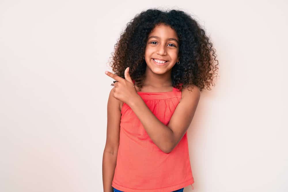 A teenage daughter after removing Fulani braids, the perfect protective style for busy young black girls.