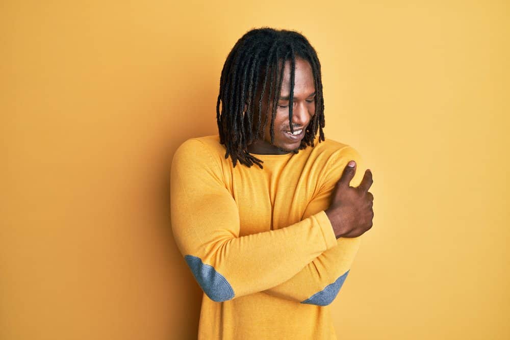 African man with natural flowing dreads created using a YouTube video explaining the semi-freeform locs method.