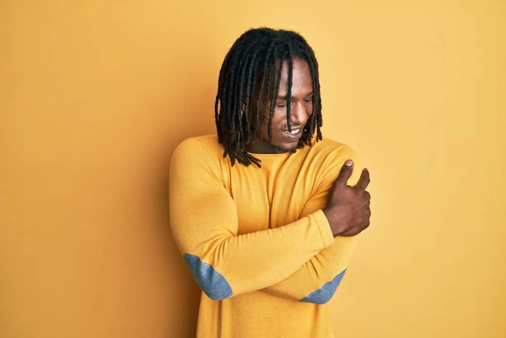 How to Get Freeform Dreads Fast: DIY Step-by-Step Guide 4 African man with natural flowing dreads created using a YouTube video explaining the semi-freeform locs method.
