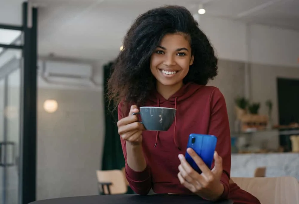 Is BioSilk Good for Your Hair? What About Their Shampoo and Conditioner? 1 A black girl with frizzy hair before using BioSilk Therapy Serum to make her colored hair soft and absolutely amazing.