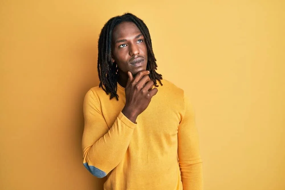 How to Get Freeform Dreads Fast: DIY Step-by-Step Guide 7 A dark-skinned African American male wearing casual weekend clothing has blooming dreads on type 4 hair strands.