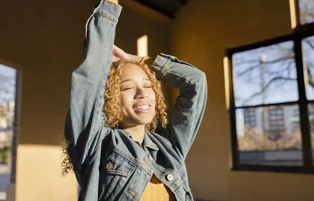 15 Cute Birthday Hairstyles for White and Black Girls 26 An enchanting woman with abundant curls elegantly styled into a sensational birthday hairdo.