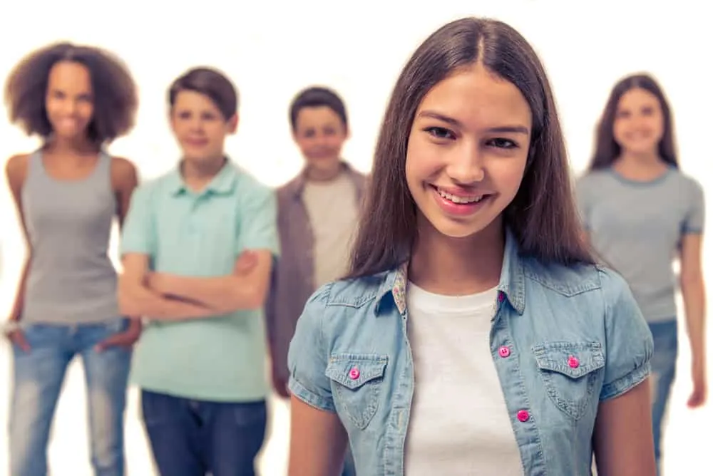 Popular 80s Teenager Hairstyles for Black and White Girls 17 A cute teenage girl in the punk movement with a straight hairstyle created with a rat tail comb.