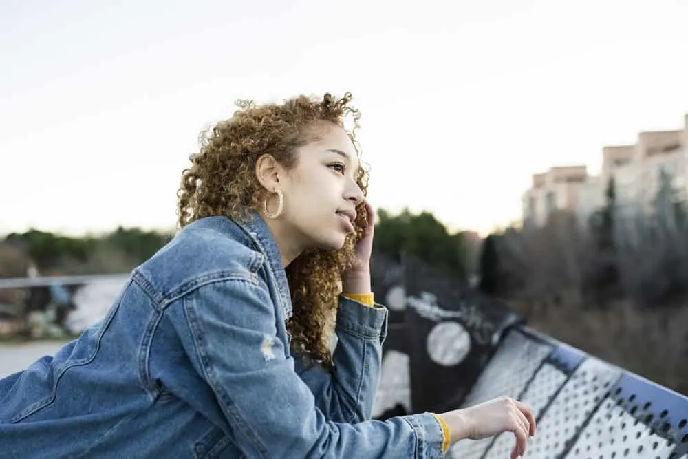15 Cute Birthday Hairstyles for White and Black Girls 8 A gorgeous young Hispanic birthday girl wearing a yellow sweater and a blue jacket as her birthday outfit.