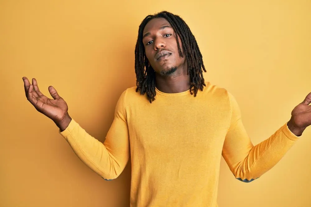 How to Get Freeform Dreads Fast: DIY Step-by-Step Guide 2 A young African American male with thicker dreadlocks that will form naturally due to his natural hair's texture.