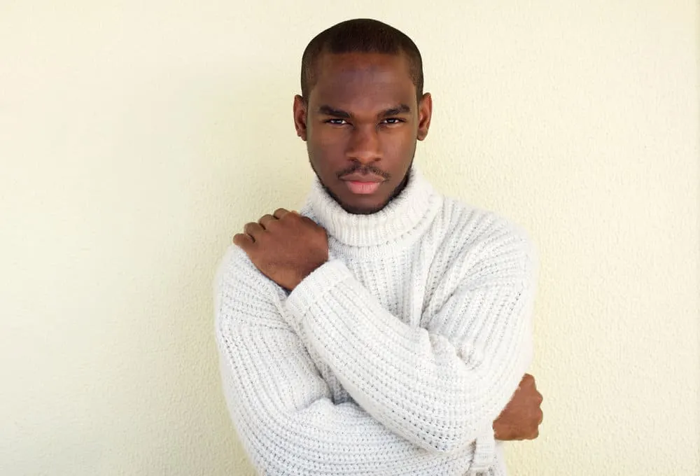 8 Types of Military Buzz Cut Fade Styles, Designs, and Ideas 17 African American male wearing an induction cut keeps his hair trimmed short, but it highlights his receding hairline.
