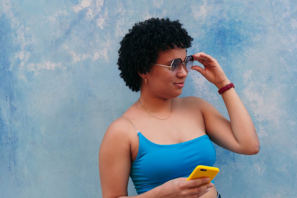 African American male with thick hair wearing a short bob style on her hair's natural texture.