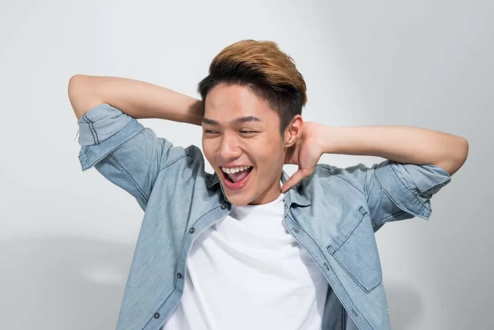 Asian Men Hairstyles: 15 Best Hairstyles for Asian Guys 10 Daring and debonair, this Asian man rocks a Korean haircut with a textured fringe to create contrast on his low fade.