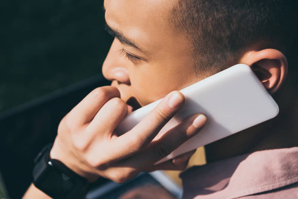 This Asian man's two-block hairstyle with defined thick hair gives him a put-together look that requires minimal styling.