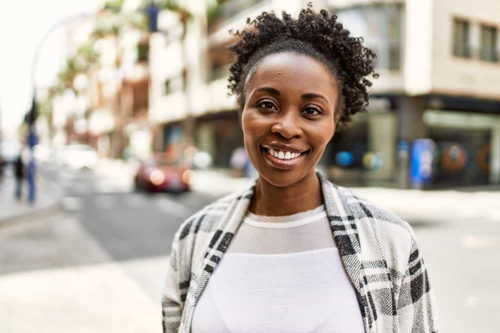 African American woman with dark hair is the epitome of beauty and confidence.