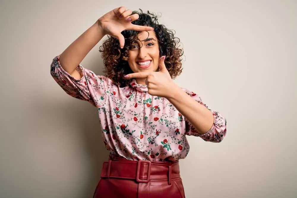 11 Best Hair Color Ideas, Shades, Trends, and Inspo for Women 18 Natural curls take center stage, with light brown highlights adding a touch of glam to a woman's burgundy hair color.