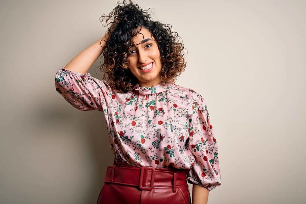 11 Best Hair Color Ideas, Shades, Trends, and Inspo for Women 1 A young woman with black hair and a light brown hair color provides face-framing highlights for her brown skin color.