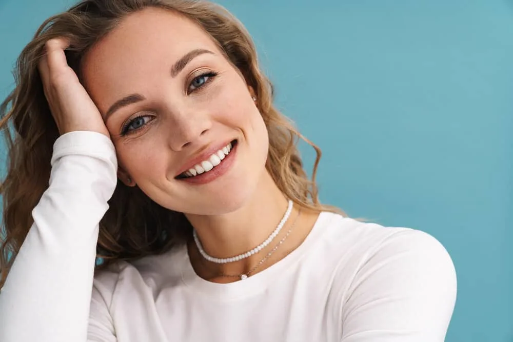How to Fix Gummy Hair After Bleaching, Perm, or Washing 1 A cute white girl with gummy bleached hair is experiencing hair breakage and split ends from over-processing.