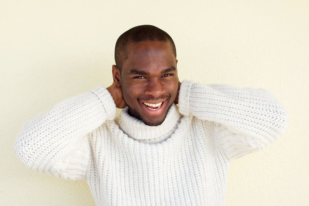 A handsome young African American male wearing one of our favorite Army haircuts and beard styles.