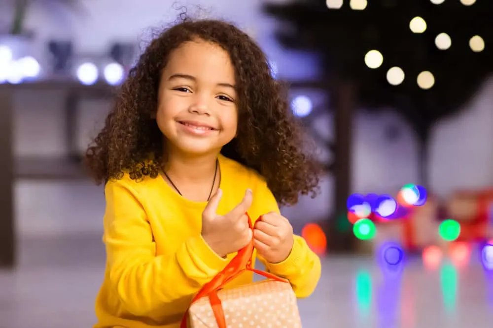 15 Cute and Easy Toddler Girl Hairstyles with DIY Tutorials 10 A charming baby girl is wearing her hair loose after her wet hair was towel-dried with a microfiber cloth.