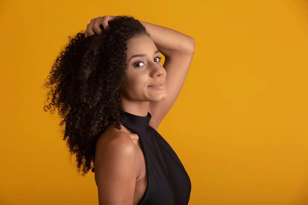 Most Popular Girl Haircuts for Teenagers and Young Adults 1 A cute young black girl with thick hair and a great smile is wearing her natural texture on face-framing layers.