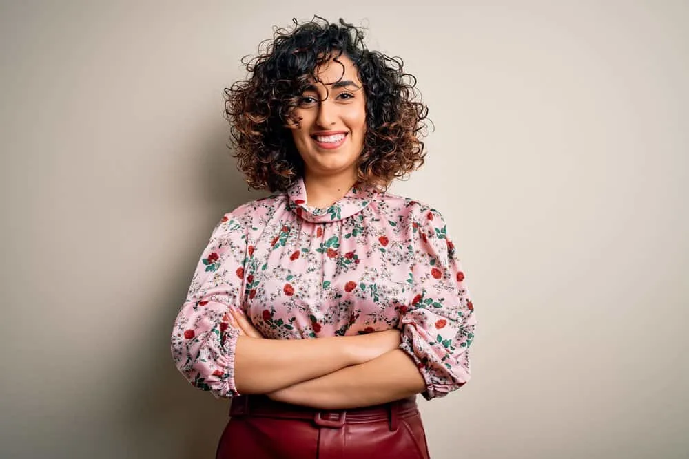 11 Best Hair Color Ideas, Shades, Trends, and Inspo for Women 8 Natural curls get an elegant upgrade with subtle light brown highlights on dark roots on a beautiful woman.