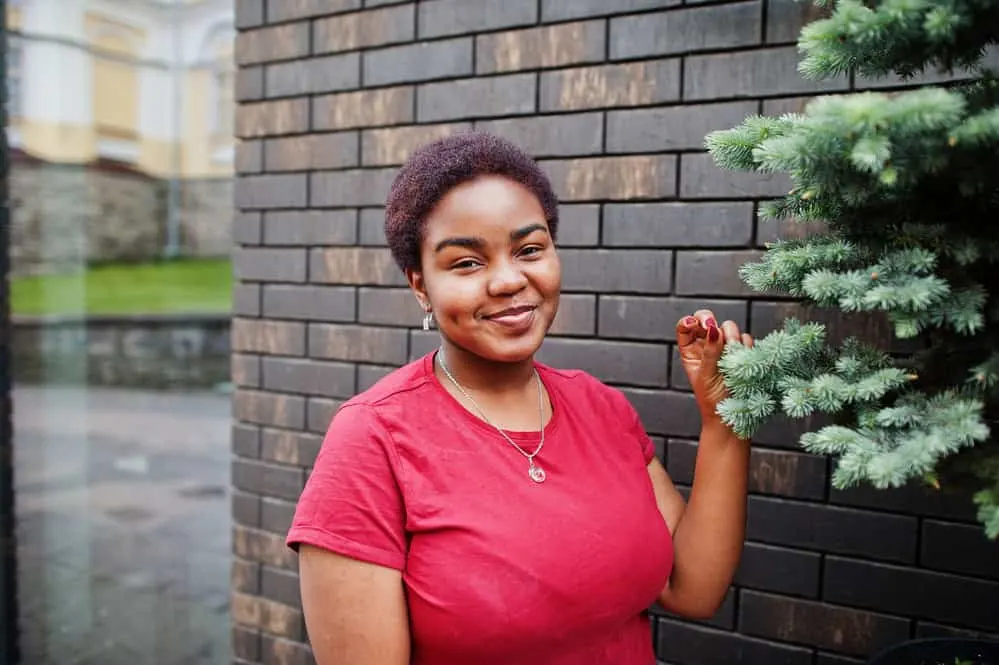 15 Easy and Simple Short Natural Hairstyles for 4C Hair 1 A black female with a 4C kinky hair texture wearing very short hair that highlights natural curls and coily hair strands.