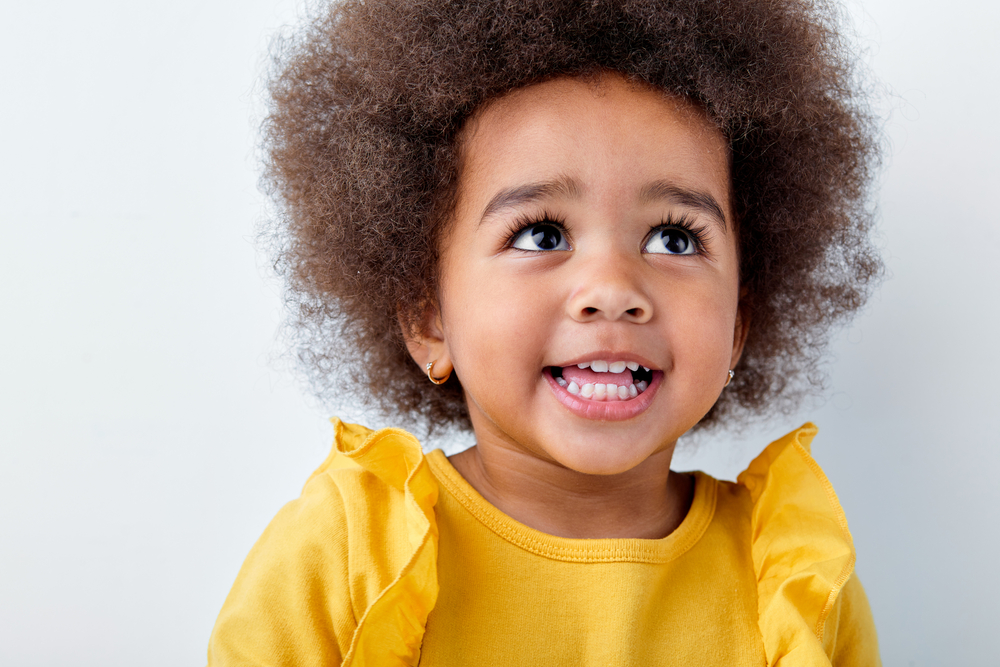 An adorable toddler with a simple look that's perfect for a special occasion like a wedding or going to church.