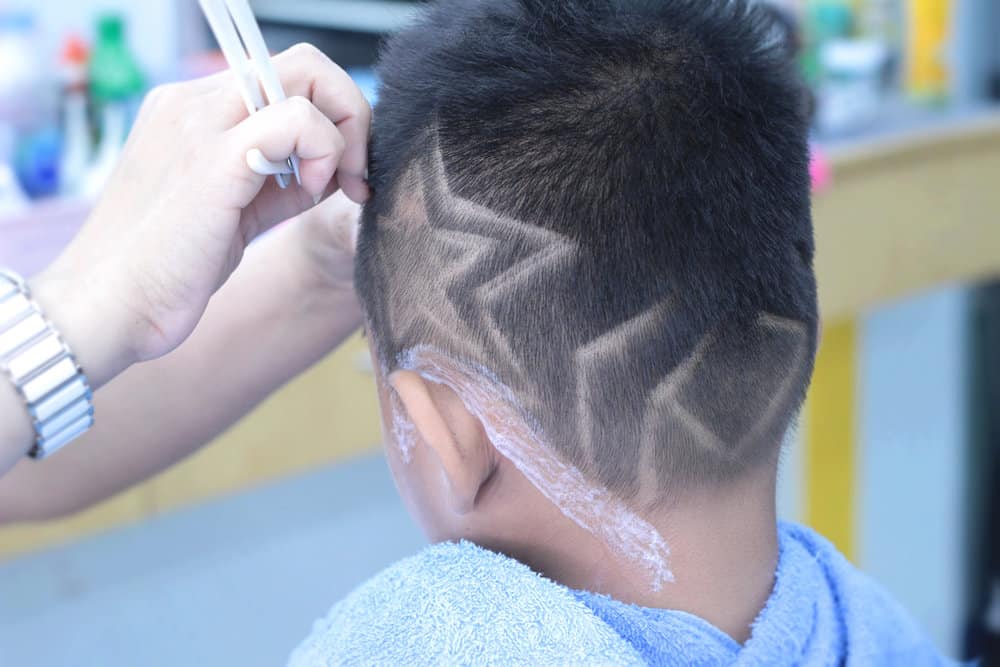 The sharp edges of this line-up haircut add a touch of distinction to this little boy's straight hair type.