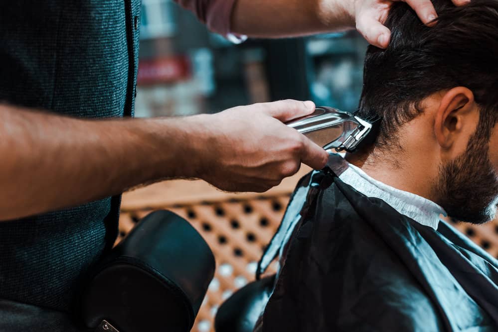 12 Different Edgar Cut Styles With Step-By-Step Tutorials 19 A white man's spiky texture goes from messy and unkept to an Edgar hairstyle on this client's type 1 hair type.